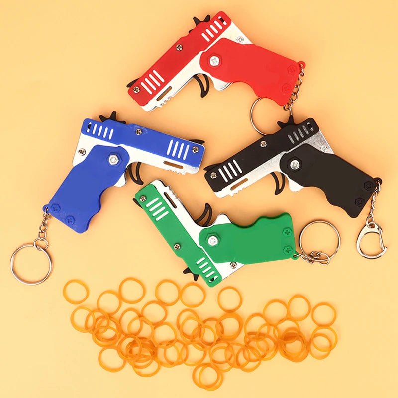 Mini Rubber Band Gun Keychain: Alloy Pistol Toy for Kid's Outdoor Fun